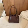Bolsa de mão feminina da moda 2026 bolsa de ombro transversal versátil bolsa de balde trançada nova niche outono bolsa de axila