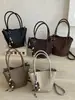 Bolso Shuai Mi Jia, color liso, elegante, nuevo modelo 2026, bolso de hombro casual, bolso de axila de moda, bolso cubo tejido para el día a día