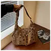 Bolsa de Lona Feminina Outono Inverno 2026 Nova Pequena Design de Nicho Bolsa de Ombro Único Transversal Estilo Coreano Casual Popular Este Ano Bolsa Tote