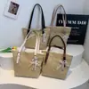 Bolsa da Moda Feminina 2026 Nova Bolsa de Grande Capacidade Verão de Mão Personalidade Casual Simples Tecida em Palha Bolsa Tote Estilosa