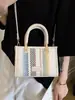 Bolso pequeño cuadrado tejido de estilo étnico con bloques de color y diseño de bolso de mano vintage, adecuado para uso casual, bolso cruzado de nicho para el día a día