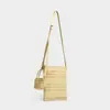 Bolso tejido a mano nuevo de nicho con diseño calado y sensación de alta gama, bolso de paja estilo vacacional, bolso de playa, bolso bandolera tipo cubo