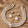 Collar de perlas con cadena de clavícula y cruz ovalada de ojo de gato con incrustaciones de diamantes, collar retro de estilo francés con perla larga distintiva para mujer