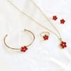 CDD doble cara nuevo flor de ciruelo juego de cuatro piezas collar aretes pulsera anillo aretes traje suministro comercio exterior