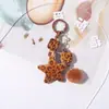 Pingente de estrela de cinco pontas com estampa de leopardo em formato de coração, best-seller transfronteiriço, um charmoso e único pingente de miçangas com estampa de leopardo para bolsas e chaveiros