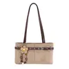 Bolso bandolera de nicho retro estilo coreano para mujer, principios de otoño 2026, bolso tote de hombro casual versátil de alta gama