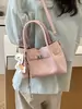 Bolso de mano vintage de nicho estilo coreano, nuevo modelo verano 2026, gran capacidad, simple, adecuado para ir al trabajo, bolso tipo cubo de un solo hombro cruzado