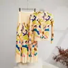 Traje de dos piezas con falda de camiseta plisada estampada de dibujos animados, popular moda de comercio exterior europeo y americano, traje de personalidad para mujer, estilo occidental