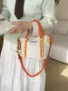 Bolso cubo transfronterizo nuevo, bolso pequeño ligero y casual de moda para exteriores, bolso de hombro cruzado versátil con bloques de color para el trabajo