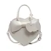 2025 Bolsa Nueva Principios de Primavera Linda Nicho Lazo Portátil Bolsa de Amor Moda Femenina Versátil Bolso Cruzado