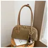 Bolso de axila retro de nicho para mujer, nueva moda otoño/invierno 2026, elegante bolso de hombro para el trabajo y los desplazamientos, bolso baguette simple