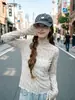 Camiseta de encaje estilo coreano de manga larga para mujer, con cuello alto, estampado floral, diseño simple de malla tejida, efecto adelgazante y silueta ajustada, perfecta como capa interior o top