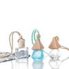 Venta al por mayor de botella de aromaterapia de vidrio creativa de 8 ml, colgante de botella vacía, subpaquete para coche, botella de aceite esencial, colgante de desodorante fresco
