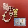 Llavero de tela con logo de empresa personalizado Cadena para teléfono móvil Angela Lámina de oro puro Oro 999 Regalo de aniversario