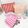 Bolsa de maquillaje impermeable de PVC, nuevo modelo transfronterizo para mujer, neceser rayado de gran capacidad, bolsa de almacenamiento de viaje versátil, fábrica