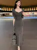 Conjunto de Dos Piezas de Falda Larga con Tirantes Plisada de Cuello de Pila Ajustada de Nuevo Estilo Primavera-Verano de Dongdaemun, Corea del Sur + Cárdigan de Manga Corta
