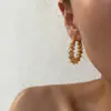 Dazan Atacado Em Estoque Moda Europeia e Americana Transfronteiriça Nicho Fashionável Estilo Ins Aço Titânio Banhado a Ouro 18K Brincos de Mola Onda Chifre