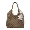 Bolso tote minimalista de lunares transfronterizo para mujer, nueva colección 2026, bolso de mano y bandolera versátil de alta gama de pana