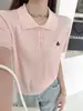 Top blanco de verano para mujer con cuello polo de hombro recto, hecho de seda helada, de manga corta, nuevo estilo popular 2026, para combinar con una falda