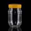 Suministro de fábrica botella redonda pequeña de 350 ml PET boca ancha plástico botella de comida para alimentos venta al por mayor de fábrica botella de embalaje para almacenamiento de verduras encurtidas