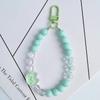 Rocío blanco con la misma cadena para teléfono móvil Nuevo colgante de gato de aceite acrílico DIY colgante de bolso de auriculares con cuentas hecho a mano