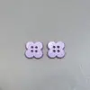 Stock Nuevo Botones de Trébol de Cuatro Hojas de Colores Camisa Chaqueta para Niños Botones Decorativos Versátiles Botones de Plástico Pintura en Spray Botones de Cuatro Agujeros
