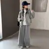 Traje de Niña Otoño 2026 Nuevo Sudadera con Capucha Estampada Casual Infantil para Niños Medianos y Mayores Primavera y Otoño Pantalones de Pierna Ancha con Encaje