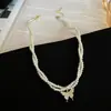 Collar de mariposa con microincrustaciones de circonita y doble perla de vidrio, cadena de clavícula de lujo, elegante y de nicho, con cuentas de arroz de celebridades cibernéticas.
