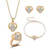 Un conjunto de pendientes collar anillo de corazón de melocotón chapados en oro con circonita microincrustada de material de cobre conjunto de cuatro piezas de joyería de comercio europeo y americano