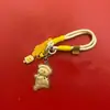 Nuevo Estilo Shuibei Oro Imitación Lindo y Adorable Oso Mantequilla Llavero Colgante para Teléfono Colgante para Bolso Decoración