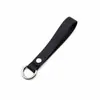 Diretamente do fabricante, chaveiro criativo em couro PU com argola de mola destacável, cordão de couro genuíno, pulseira anti-perda para chave de carro
