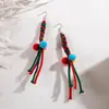 Brincos de Natal Europeus e Americanos Transfronteiriços Divertidos Coloridos Trançados com Bola de Pelo Contrastante Design de Nicho Brincos de Contas de Arroz para Mulheres