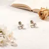 Explosiones moda europea y americana dulce simple acero de titanio alta calidad aretes que conservan el color aretes hembra hebilla de rosca doble cabeza anti-caída