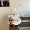 Bolso tipo almohada de nicho de lujo ligero para mujer 2026 Nuevo de moda Versátil Bolso de mano y bandolera de moda para el trabajo Casual Bolso Boston