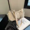 Bolso de Mujer de Alta Gama Transfronterizo Diseño de Nicho Bolso de Hombro con Borlas para Mujer Nuevo 2024 Bolso Mini tipo Bagel