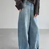 Jeans de diseño Dongdaemun coreano con hebilla en la cintura trasera, color azul lavado, dobladillo curvo para mujer, pantalones anchos de otoño, pantalones tipo dad