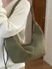 Yuezhi 2026 principios de otoño nuevo modelo de alta gama diseño de bolsa grande con patrón tejido bolsa de albóndiga para la ciudad bolsa de hombro retro bajo el brazo