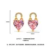 Estilo dulce y girly versátil de lujo ligero y sofisticado, diseño de nicho, aretes de corazón con candado de circón rosa y morado, aretes de oro arenoso