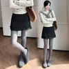 Falda corta de lana para mujer, colección otoño e invierno 2026, falda de lana línea A de cintura alta, shorts anti-exposición, bordes con volantes, minifalda súper elegante