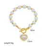 Moda retro europea y americana pulsera de perlas de lujo ligero colgante de corazón incrustado de diamantes hebilla de langosta pulsera de temperamento para dama venta al por mayor