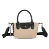 Bolso de hombro único de nailon con bloques de color transfronterizo tipo bolsa de albóndiga otoño versátil pequeño nicho bolso de mano textura de moda bolso de hombro único