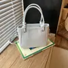 Bolsa Quadrada Pequena Simples Feminina Grande Capacidade Nova Primavera/Outono 2026 Design de Nicho Retrô Bolsa para Trabalho e Deslocamento Bolsa de Ombro Único