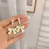 S925 Prata Agulha Leite Branco Pérola Arco Brincos 2024 Novos Brincos Da Moda Feminino Nicho Design Sense Brincos Femininos