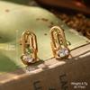 Estilo de corte europeo y americano oro ruso nicho nuevos aretes medievales borla perla diseño ojo de tigre aretes de alta gama