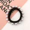 Versión coreana de perlas para uñas sin costuras 16 perlas anillo para el pelo Red simple Joker Anillo de toalla de perla cuerda de color para la cabeza al por mayor