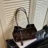 Hebilla de cinturón de lunares de moda europea y americana transfronteriza estilo coreano bolso de mano simple para el día a día bolso tote de hombro principios de otoño 2026