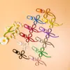 Llavero de lazo de cuentas estilo INS de colores con cinta, colgante de aleación, accesorio para niñas, charm para mochila, accesorio de hebilla para puerta