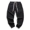 Calças masculinas de veludo cotelê slim fit da moda estilo chinês para primavera e outono, calças casuais estilo harém de cor sólida estilo retrô japonês e coreano de comércio exterior