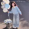 Conjunto Versátil Dulce: Top Nuevo de Patchwork con Lazo para Primavera y Otoño 2026 Combinado con Jeans de Estrellas