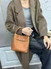 Bolsa de mão minimalista da moda transfronteiriça, bolsa de ombro e crossbody, nova bolsa de balde versátil casual primavera/verão